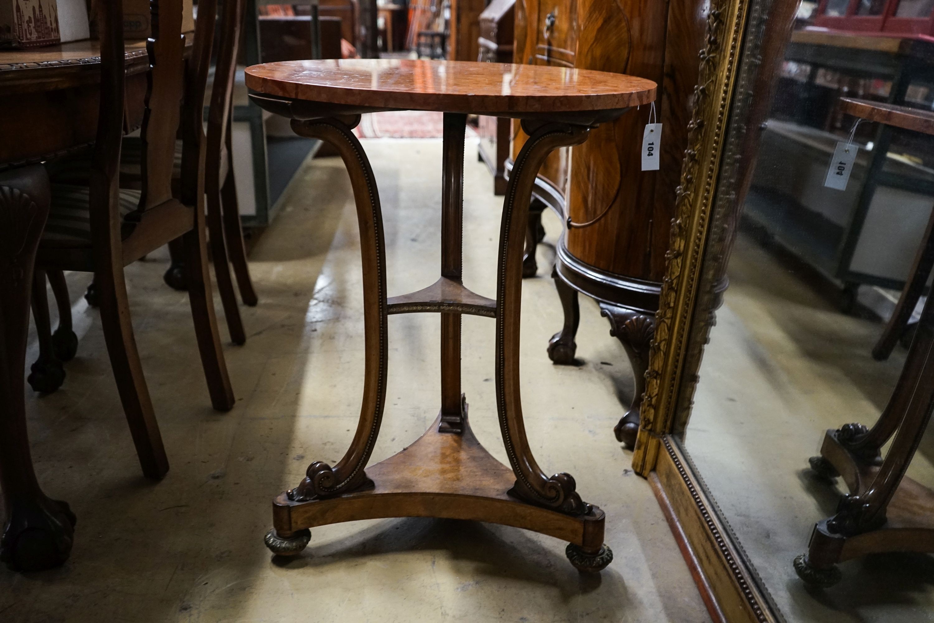 A Victorian gilt metal mounted walnut circular marble top table, diameter 60cm, height 73cm